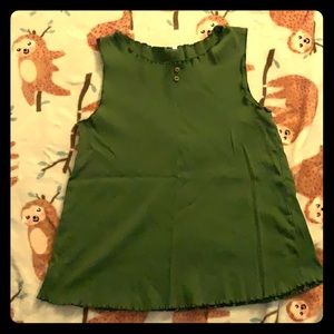 A green short sleeve shirt